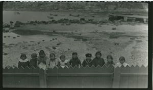 Image: Eskimo [Inuit] children looking over hospital fence